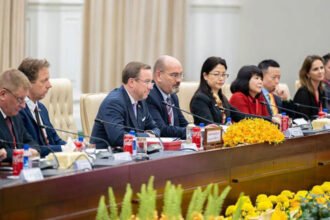 EU business delegation with Cambodian government officials in Phnom Penh for trade discussions.