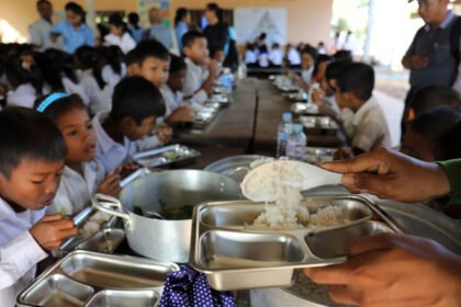 Officials and vendors at a food market highlighting healthy and affordable food reforms in Cambodia