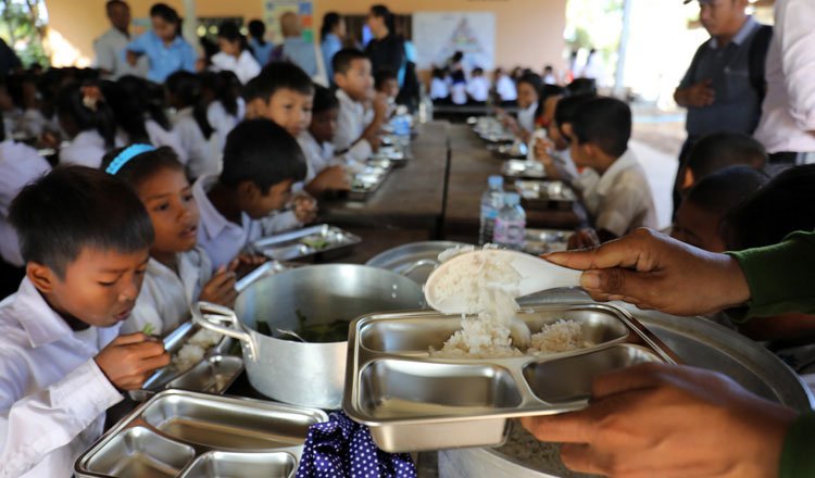 Officials and vendors at a food market highlighting healthy and affordable food reforms in Cambodia