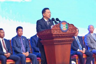 Cambodian industrial zone with factories and cranes showing industrial growth