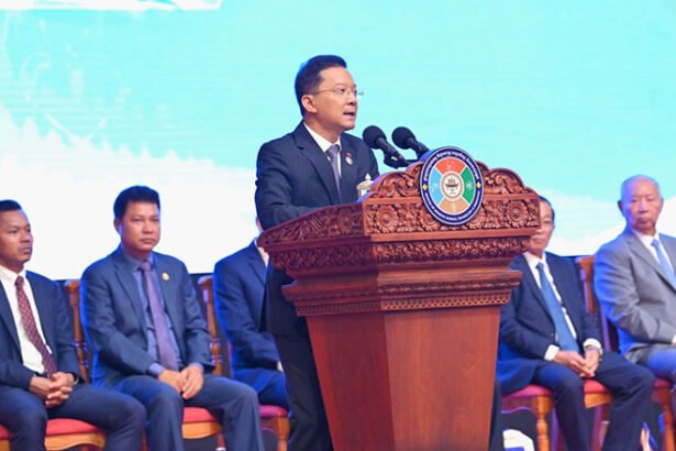 Cambodian industrial zone with factories and cranes showing industrial growth