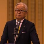 Japanese Ambassador and Cambodian officials at funding handover for water supply and school projects.