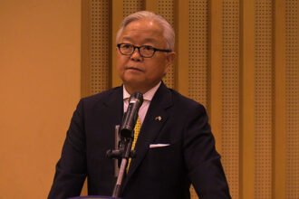 Japanese Ambassador and Cambodian officials at funding handover for water supply and school projects.