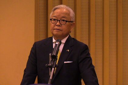 Japanese Ambassador and Cambodian officials at funding handover for water supply and school projects.