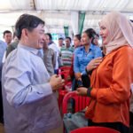 Group of Cambodian returnee migrant workers attending a job placement session supported by government and private sector partners