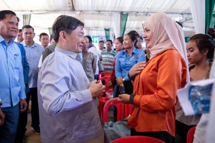 Group of Cambodian returnee migrant workers attending a job placement session supported by government and private sector partners