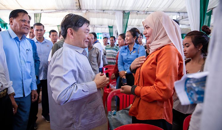 Group of Cambodian returnee migrant workers attending a job placement session supported by government and private sector partners
