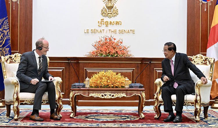 Peter Altmann AfD board member meeting Cambodian leaders during Cambodia development visit