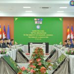 Cambodia garment factory workers producing clothing in manufacturing facility