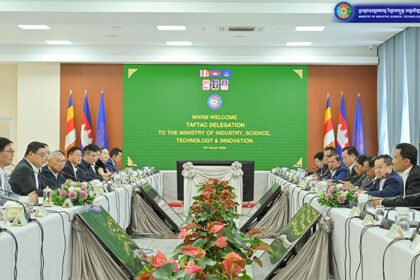 Cambodia garment factory workers producing clothing in manufacturing facility