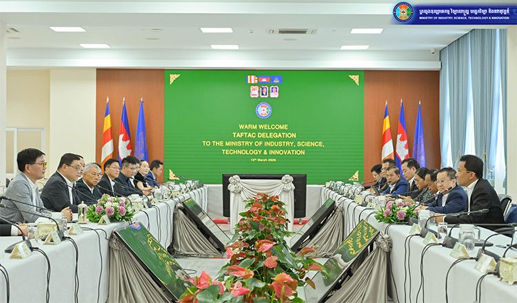 Cambodia garment factory workers producing clothing in manufacturing facility