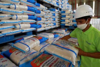 Cambodian rice bags stacked for export shipment as the country records an 83 percent increase in rice exports in early 2026.