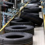 Rubber plantation workers harvesting latex as Cambodia rubber exports increase