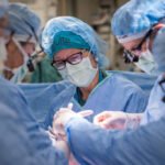 Surgeons performing the world's first in-utero stem cell therapy for spina bifida at UC Davis Children's Hospital