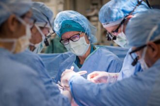 Surgeons performing the world's first in-utero stem cell therapy for spina bifida at UC Davis Children's Hospital