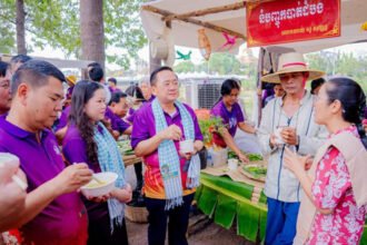 Tourists enjoying traditional Khmer food and cooking demonstrations at Battambang food festival