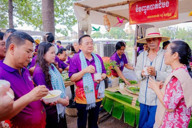 Tourists enjoying traditional Khmer food and cooking demonstrations at Battambang food festival