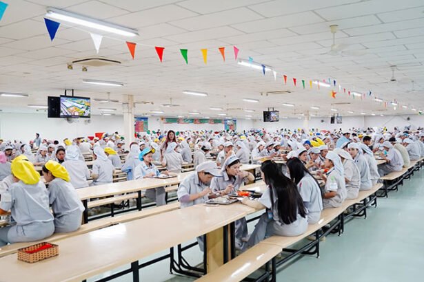 Cambodia fortified rice nutrition program for factory workers showing meal distribution in industrial zone