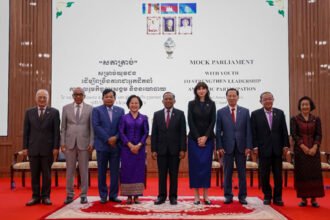 Young participants in Cambodia’s mock parliament programme engaging in simulated legislative discussions to promote youth leadership and women’s participation.