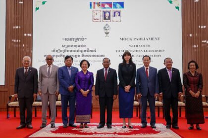 Young participants in Cambodia’s mock parliament programme engaging in simulated legislative discussions to promote youth leadership and women’s participation.