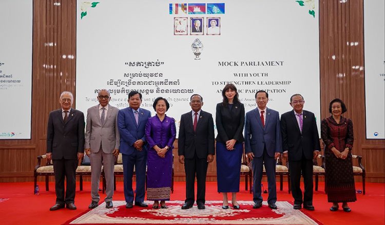 Young participants in Cambodia’s mock parliament programme engaging in simulated legislative discussions to promote youth leadership and women’s participation.