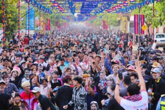 Tourists celebrating Khmer New Year in Kampong Cham Cambodia with large festive crowds and cultural activities